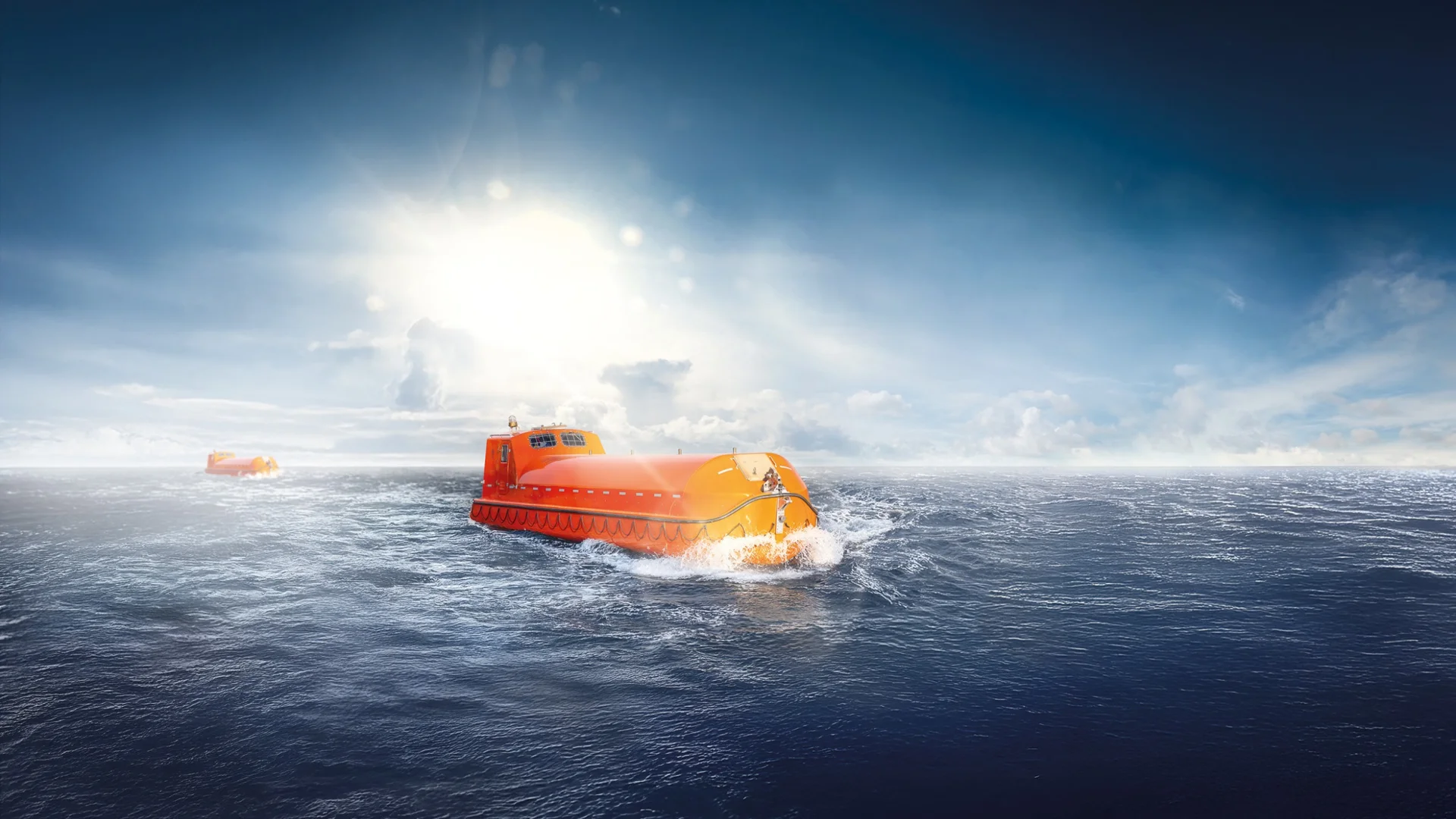 Fassmer lifeboats at sea in sunlight – closed, orange safety boats in operation on the ocean.
