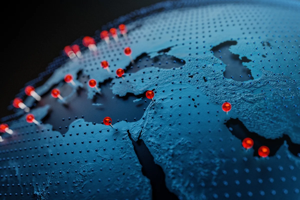 3D visualization of a world map with red markers in Europe, North Africa and the Middle East representing global service locations