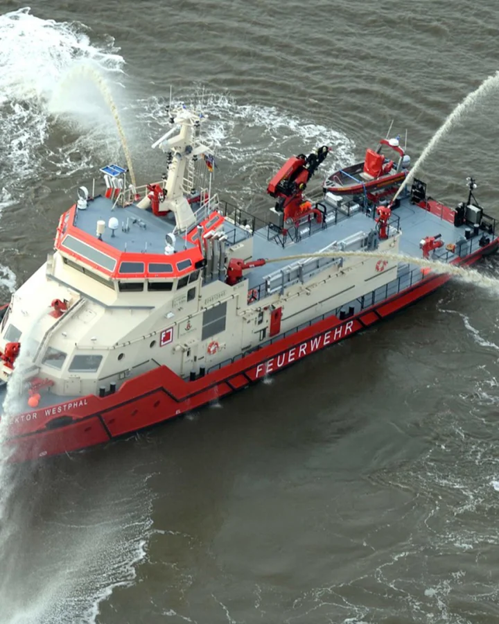 The 44 meter fire-fighting vessel Branddirektor Westphal, built by Fassmer, during a training exercise on the River Elbe. The state-of-the-art ship is equipped with multiple water cannons and supports fire-fighting and technical assistance operations in the Port of Hamburg.