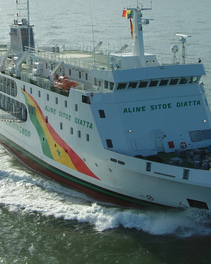 The 76 meter RoPax ferry Aline Sitoe Diatta, built by Fassmer, sailing at sea. The vessel operates between Dakar and Ziguinchor in Senegal, carrying both passengers and vehicles safely across the Atlantic.